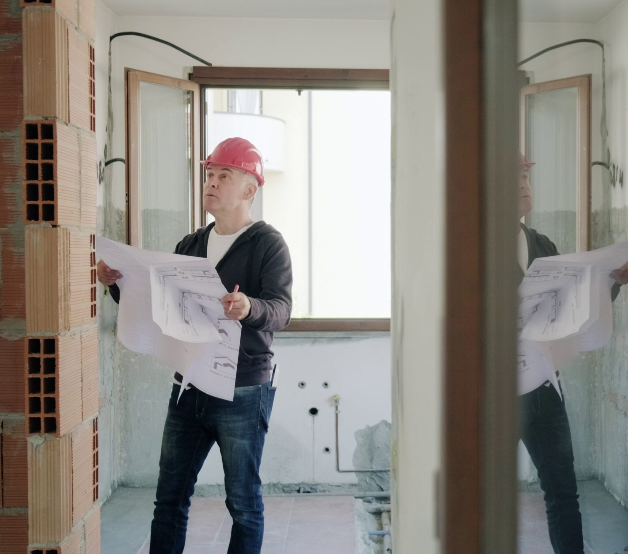 This is a picture of a worker preparing the plans for a Tucson kitchen remodel project.