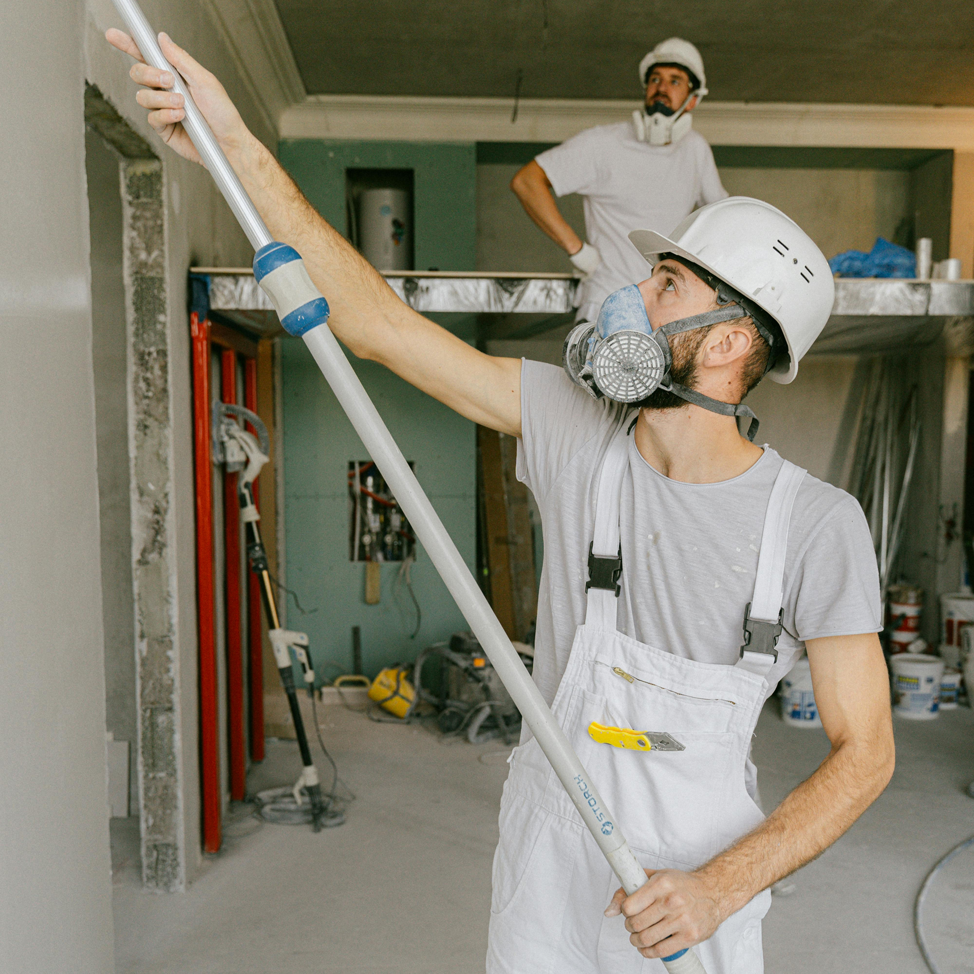 Worker cleaning up water damage to prevent mold